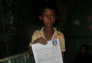Photo-2: Children showing materials for age confirmation
