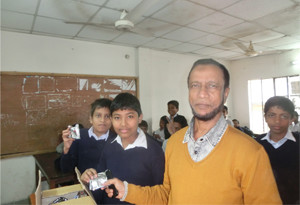 Photo-2: Cookie distribution at Ashania school