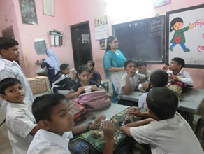 Photo-2: Children eating cookies after make-up class