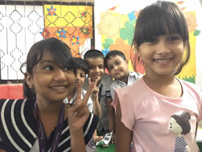 Photo-2: Children eating cookies and smiling