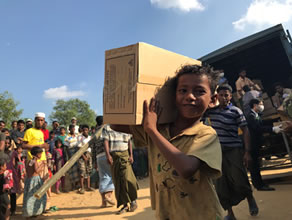 Photo-2: Rohingya refugees receiving cookies