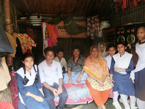 Photo-1: Students visiting a family living in a slum