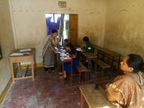 Photo-10: A slum mom waiting for her child to return after class