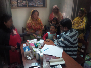 Photo-1: A child who is examined by a doctor and a mother and teacher watching over