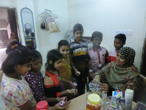 Photo-6: Jasmine selling chocolate to children