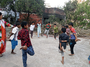 Photo-9: Children enjoying Cock Fight in the schoolyard