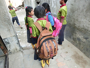 Photo-7: A child carrying a heavy rucksack