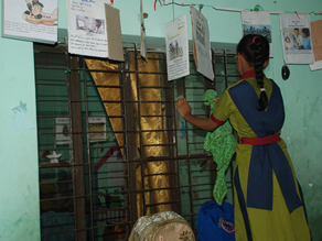 Photo 7: A child wiping the window glass of a classroom