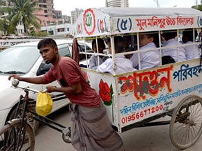 Photo-1: School van, a common way to go to school in Dhaka