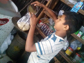Photo-3: Mr. Raihan, who sells rice by weight alone