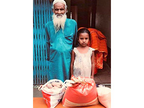 Photo-1: Family receiving major food bag rations