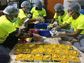 Photo-3: Volunteers preparing lunch boxes
