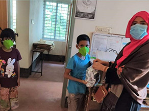 Photo-4: Cookie distribution (Monipur Elementary School)