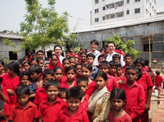 Children running up in front of the camera with a smile